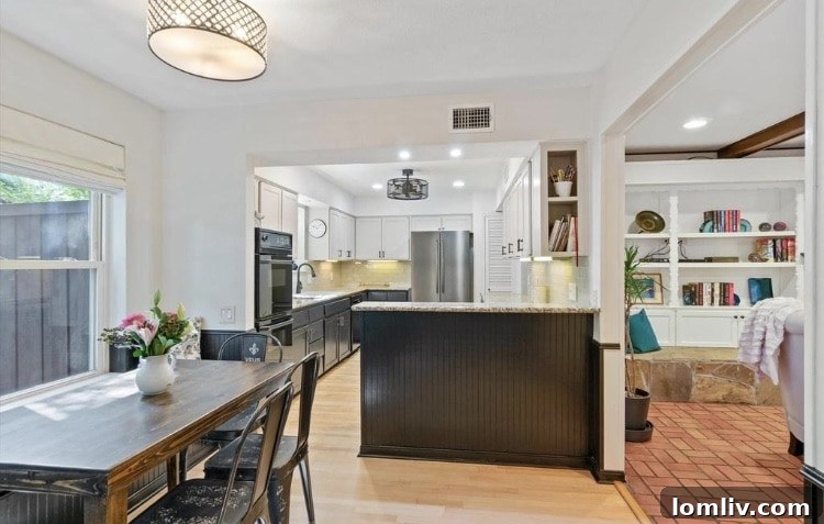 Expansive backyard with mature trees and patio