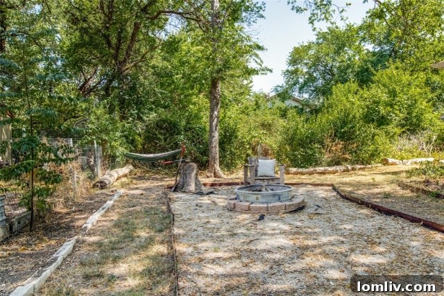 Rustic fence and undeveloped land on the property, ready for personalization