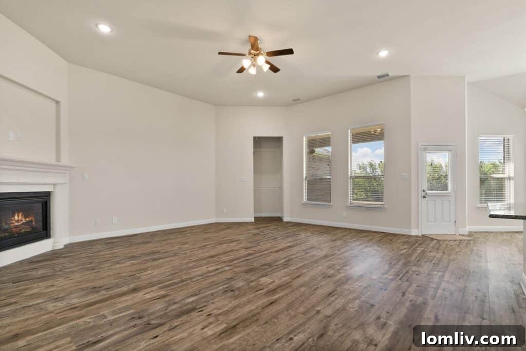 Modern kitchen with granite island and stainless steel appliances