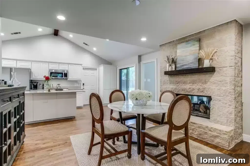 Spacious Living Room with Natural Light and Fireplace