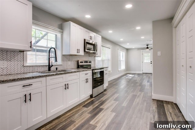 Stylish living area of the renovated Oak Cliff duplex with modern finishes