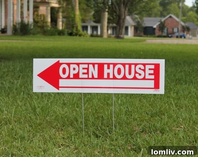 Realtor holding open house sign
