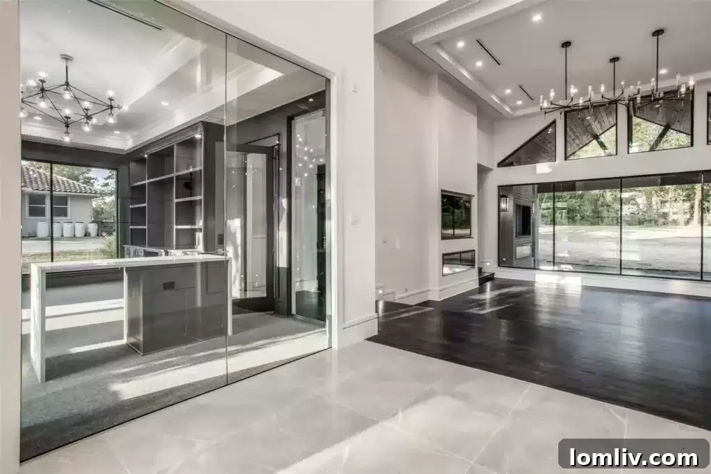 Modern glass-walled home office with custom built-ins