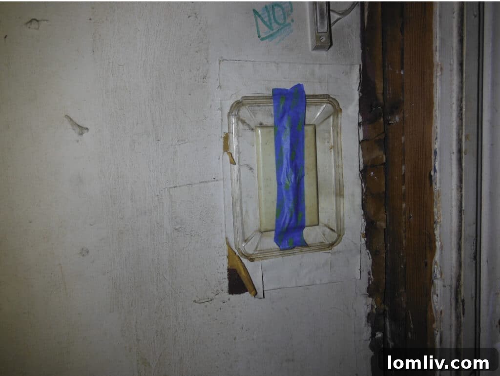 Blue Painter's Tape on a Garage Door Opener Switch