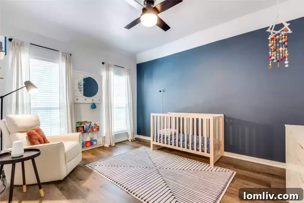 Close-up of the stylish black-rimmed mirror and quartz countertop in one of the home's updated bathrooms.