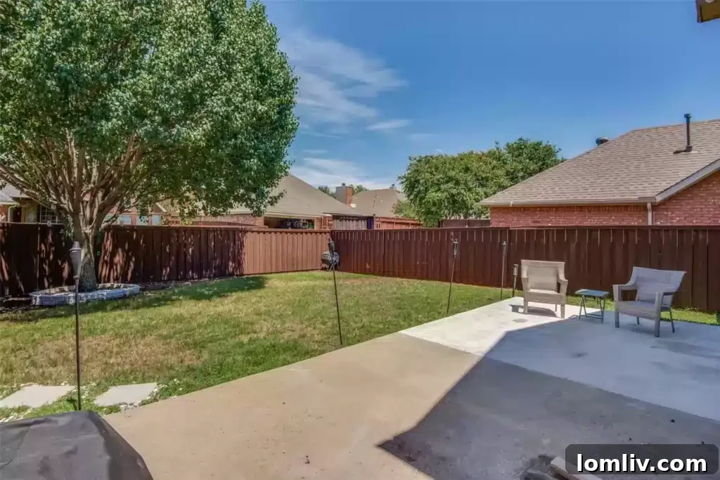 Another view of the beautifully updated bathroom with new cabinetry and modern lighting.