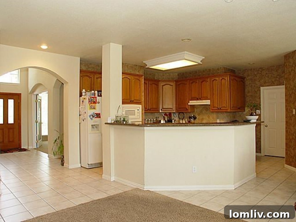 A glimpse of the original, dated kitchen from 2013, showing its traditional style before renovation.
