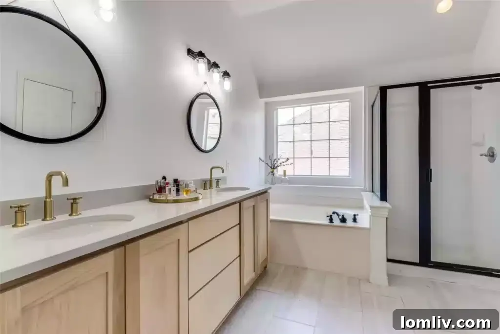Modern walk-in shower with sleek design and contemporary fixtures in the renovated primary bathroom.