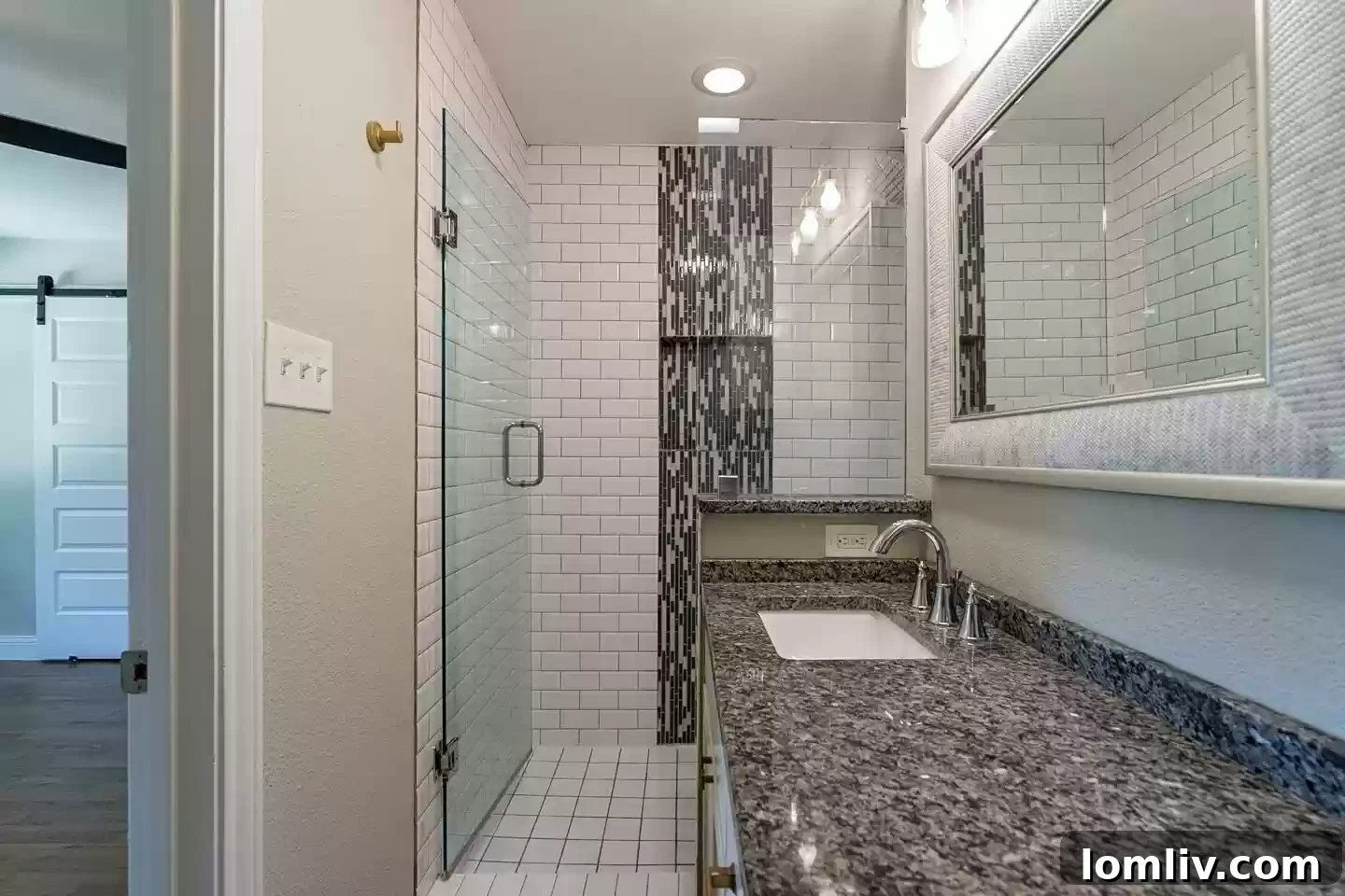 A pristine, updated bathroom featuring modern fixtures and finishes, enhancing the appeal and value of homes in East Dallas's Casa View.