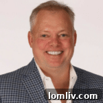 Jerry Mooty, CEO of @Properties, smiling.