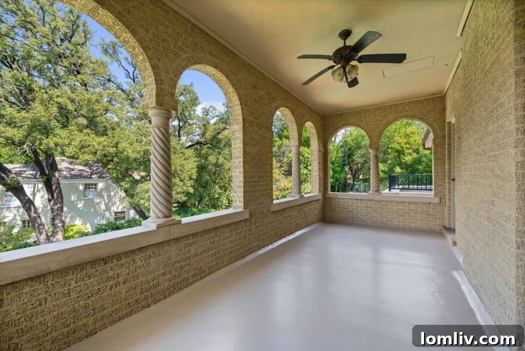 Spa-like ensuite bathroom with Rosso marble, travertine, and garden tub