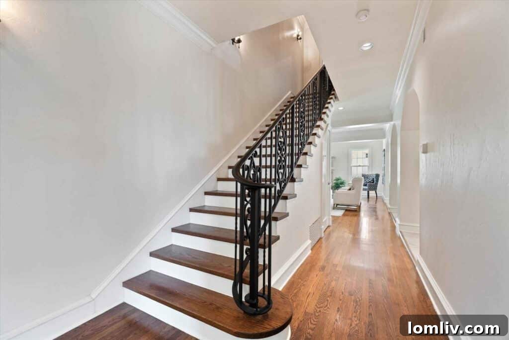 Sophisticated living room with rich oak flooring and a grand fireplace