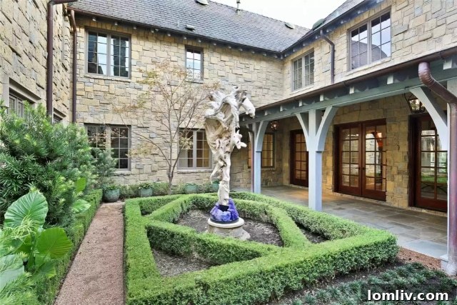 Expansive backyard with a lush lawn and elegant landscaping