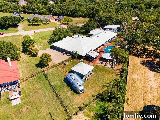 Expansive multigenerational property in Burleson, TX, featuring a pool and ample land.