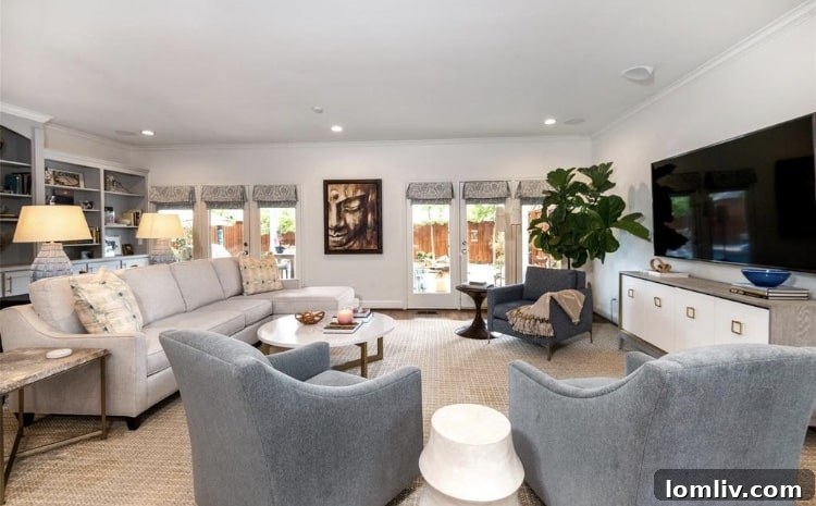 Inviting private balcony offering views of the lush backyard oasis