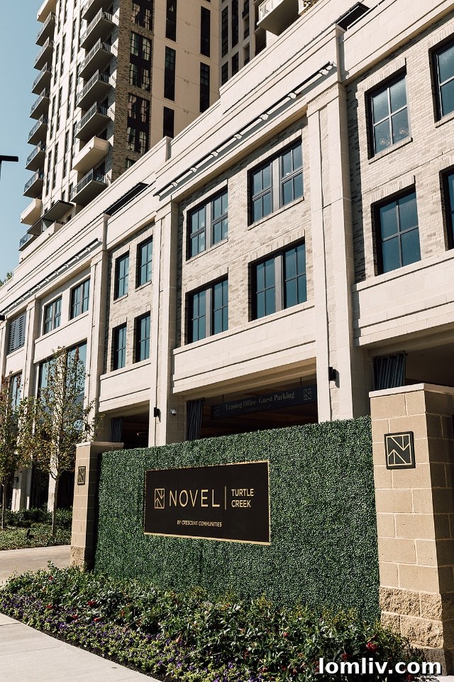 A spacious living area with abundant natural light and hardwood floors in a NOVEL Turtle Creek residence.