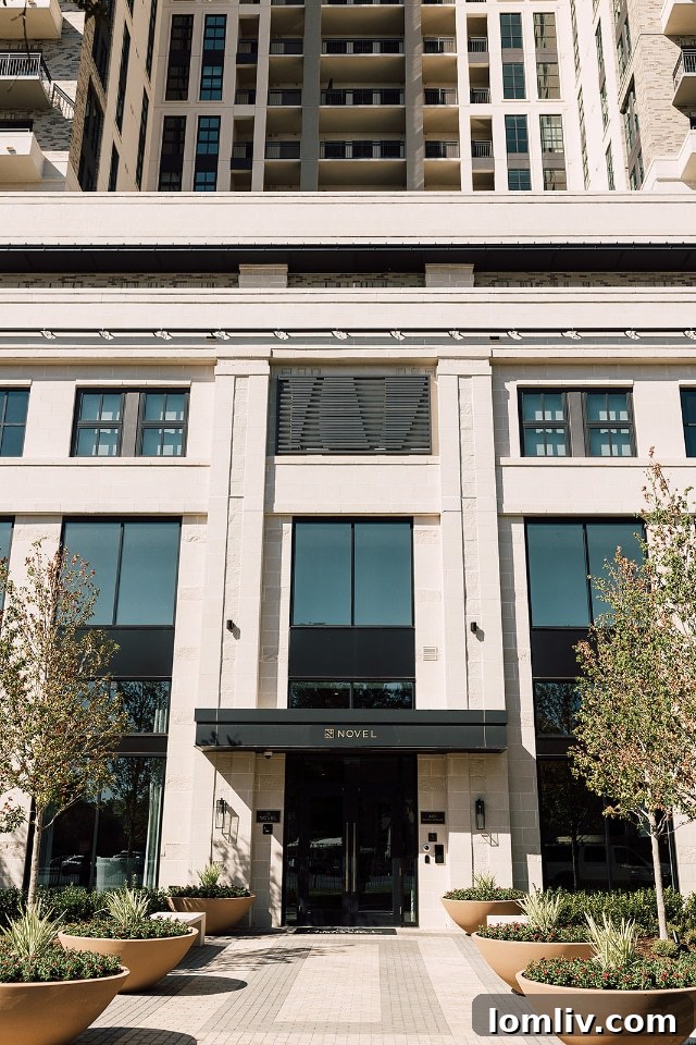 A comfortable bedroom featuring large windows and sophisticated decor.