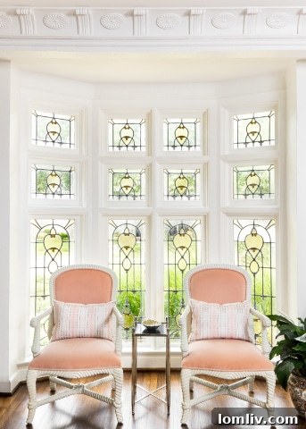 The newly renovated open-plan kitchen and dining area with modern appliances, a large island, and stylish pendant lighting.