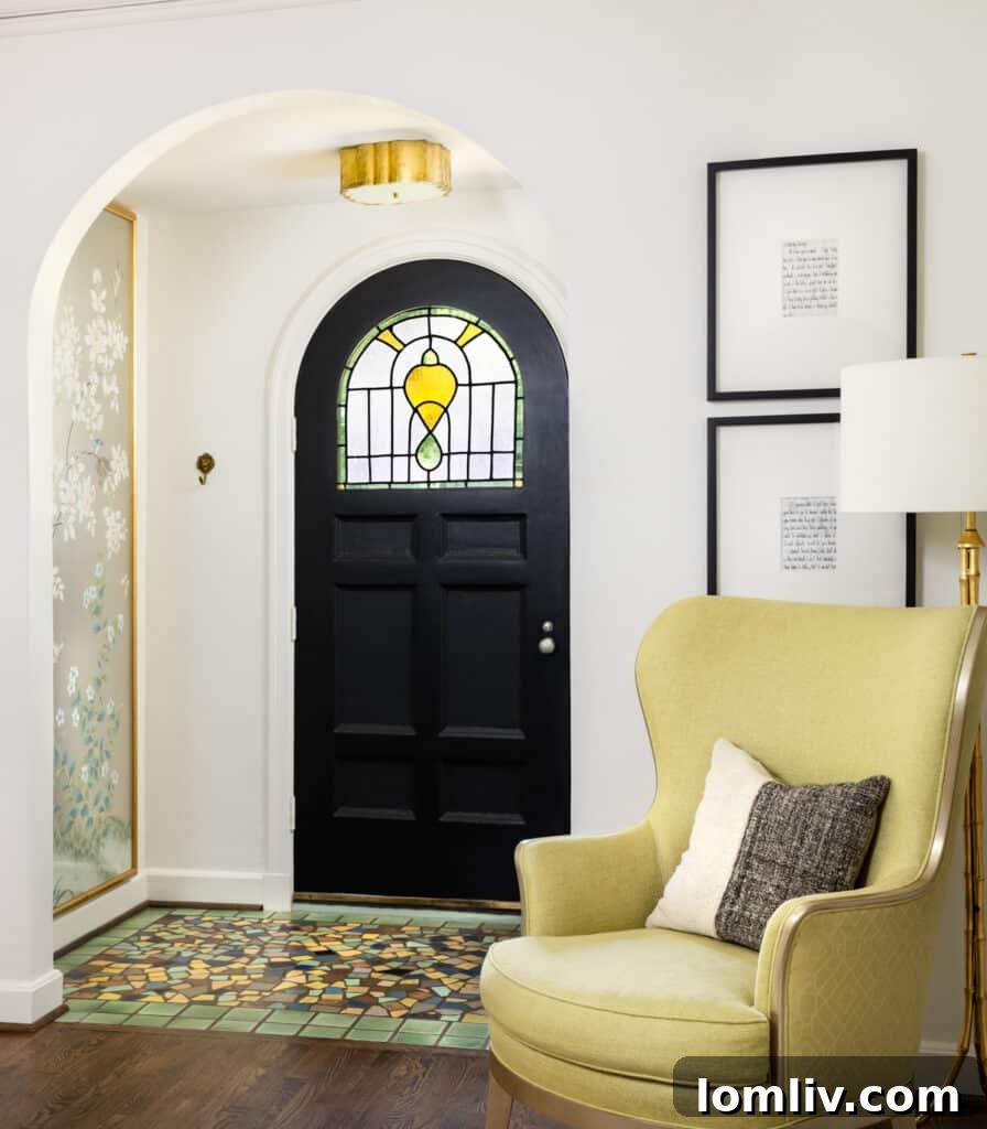 A charming fireplace with intricate tile work, showcasing the original craftsmanship within the historic Tudor home.