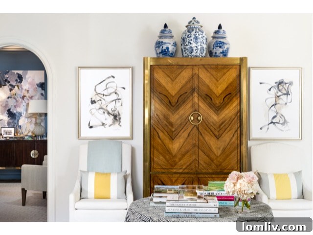 A beautifully decorated child's room under the steep pitch of the roof, featuring playful wallpaper and custom built-ins.