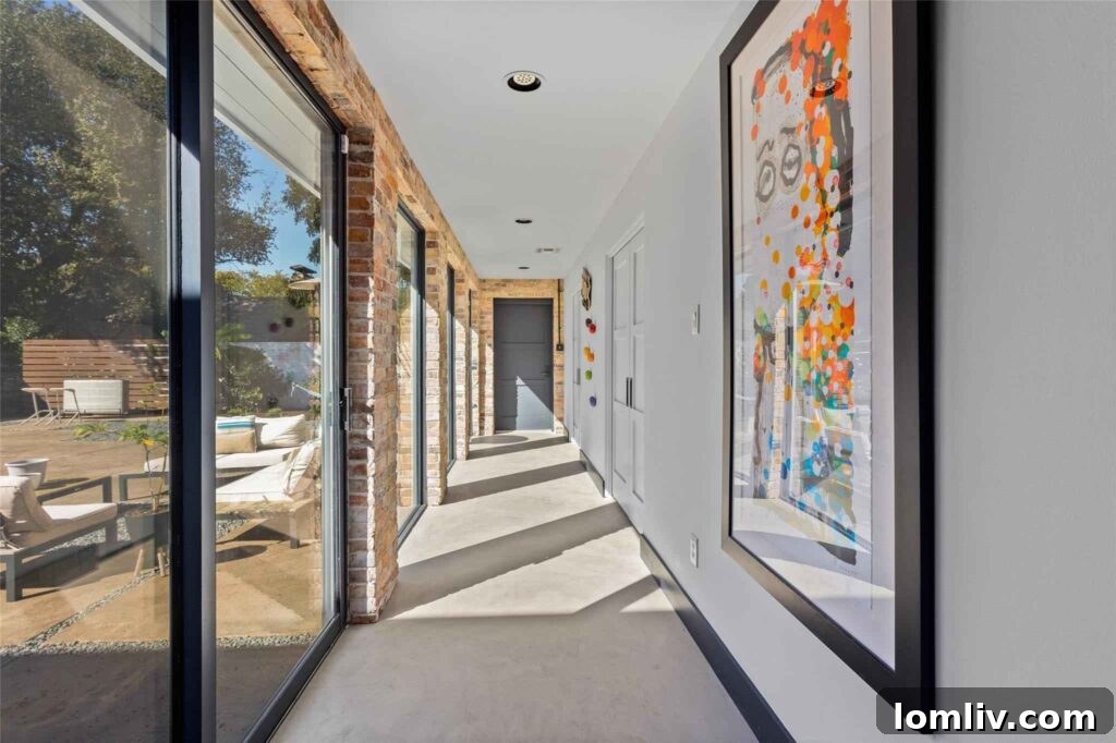 Modern Kitchen Design with Exposed Ductwork and Steel Countertops