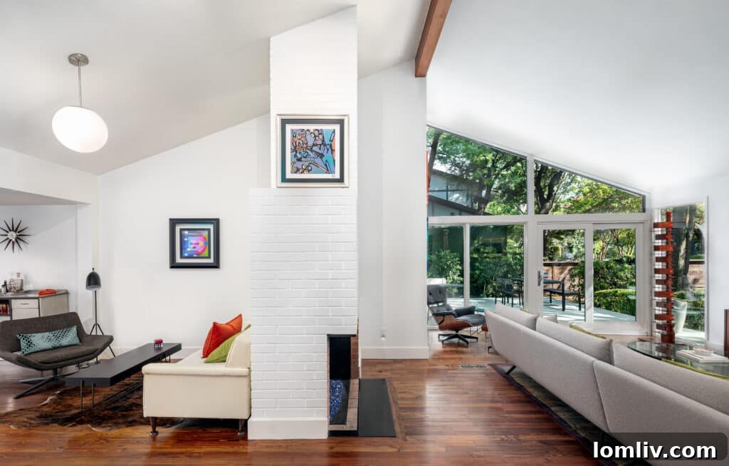 View of a serene garden from inside a Midcentury Modern home