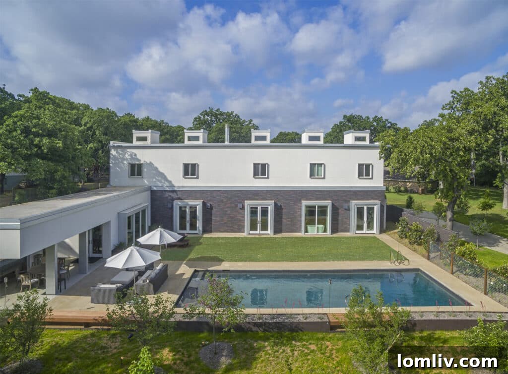 Stylish outdoor entertainment area with a pool and comfortable seating