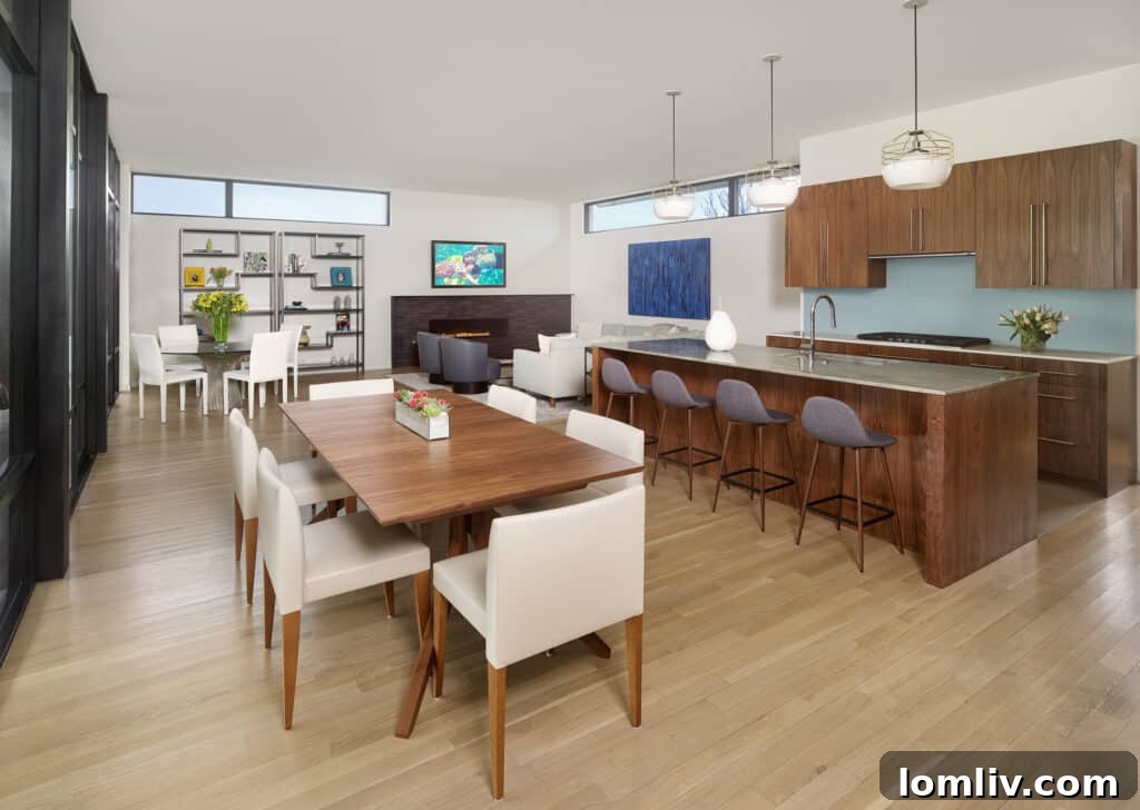 Contemporary kitchen with island and integrated appliances