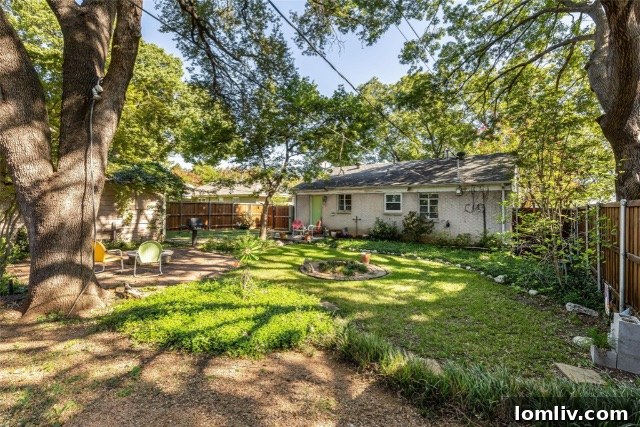 Charming green doors of the cottage, complementing the lush greenery.