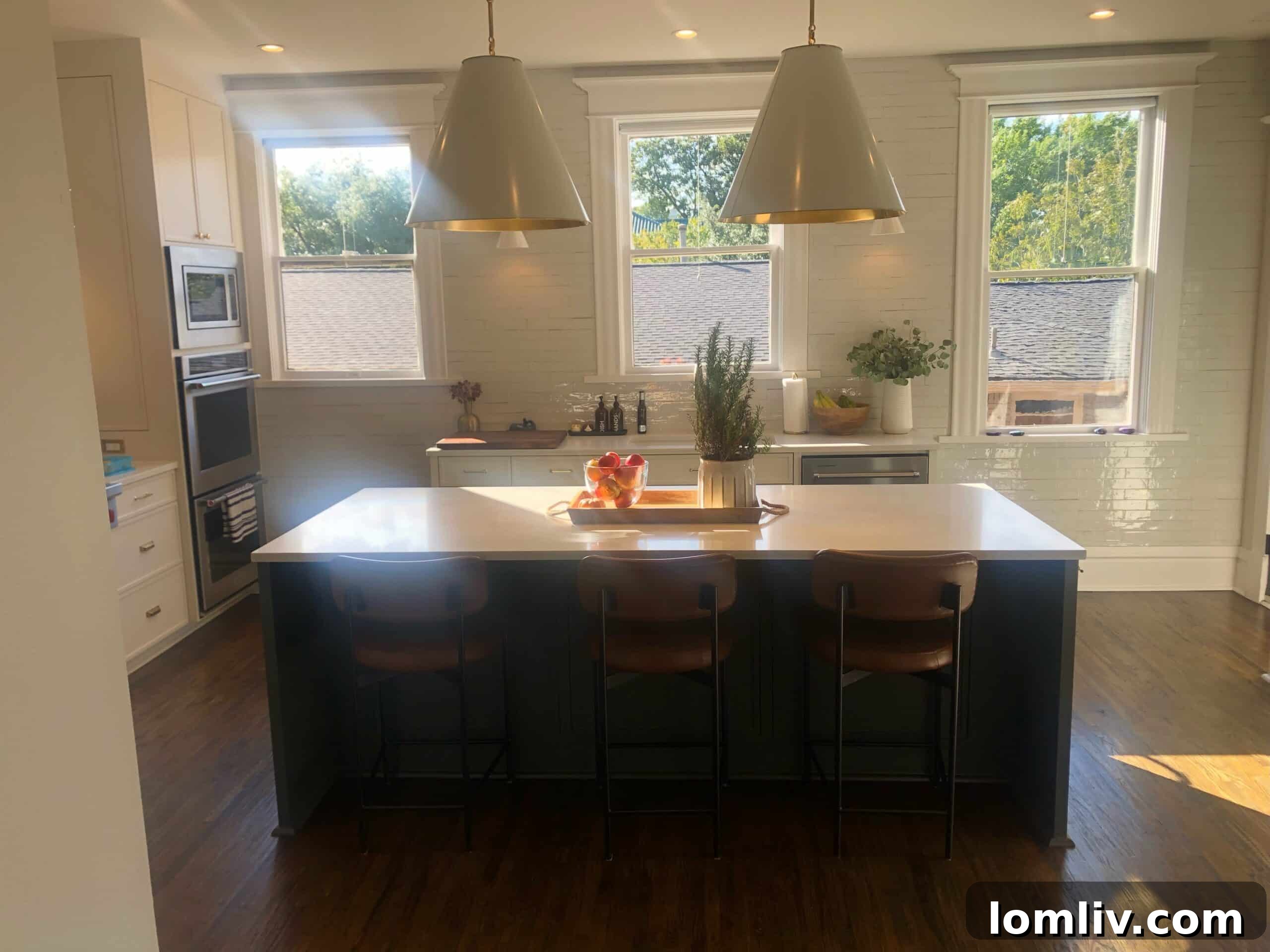 After renovation: Intimate dining room with green dado and warm tones