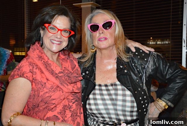 Jan McFarlane interacting with guests at her birthday party.