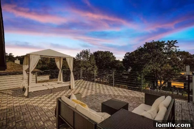 Stylish outdoor entertaining space on a roof deck with modern seating.