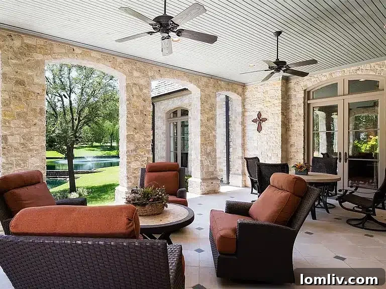 Grand exterior of the custom-built estate at 5 Robledo Drive, adjacent to a pond