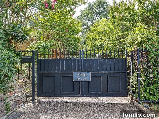 Secluded luxury home entrance behind a gate and mature trees on Arlan Lane, Fort Worth