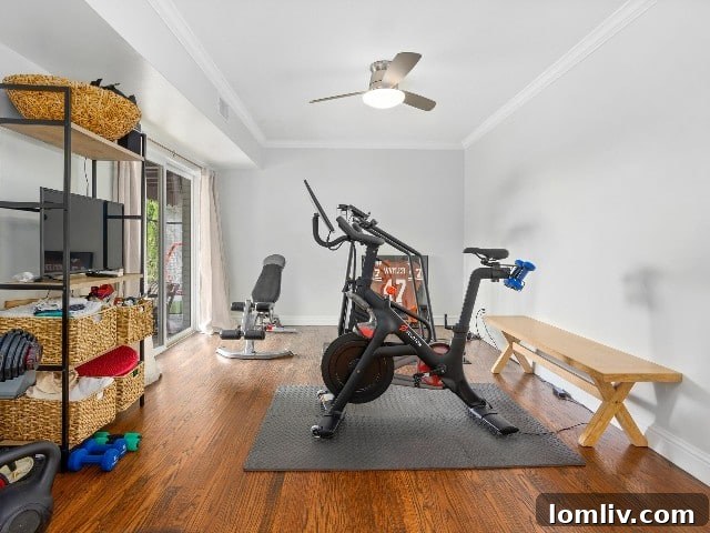 Versatile bonus room currently used as a workout area in a luxury Fort Worth home