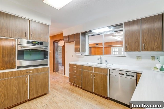 Vintage primary bathroom with cream and gold marble-look shower