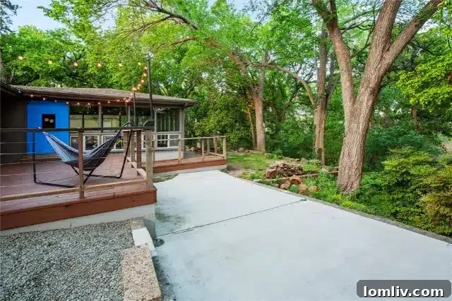 Tiered Backyard with Lush Trees at 4512 Dove Creek Way