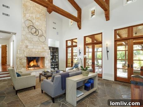 Spacious living room with stone fireplace