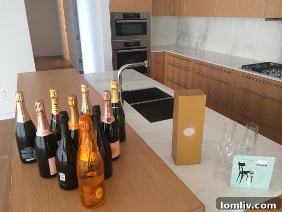 Museum Tower Dallas: An elegant client gift of champagne and glasses, symbolizing a warm welcome to a new luxury home.