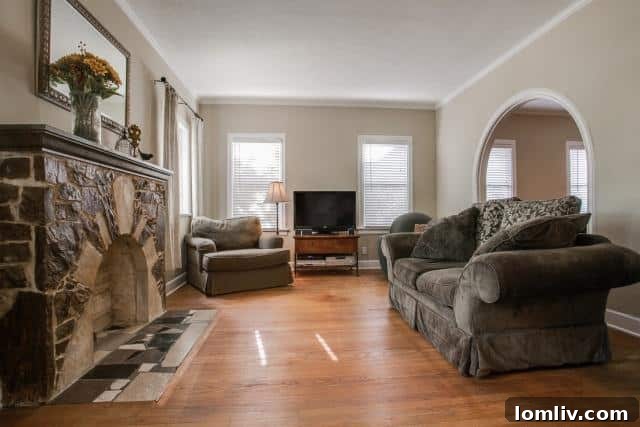 Elegant living room with fireplace in 5307 Morningside Tudor home