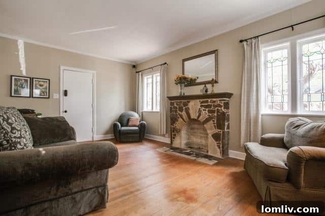Cozy living room interior showcasing fireplace and natural light at 5307 Morningside
