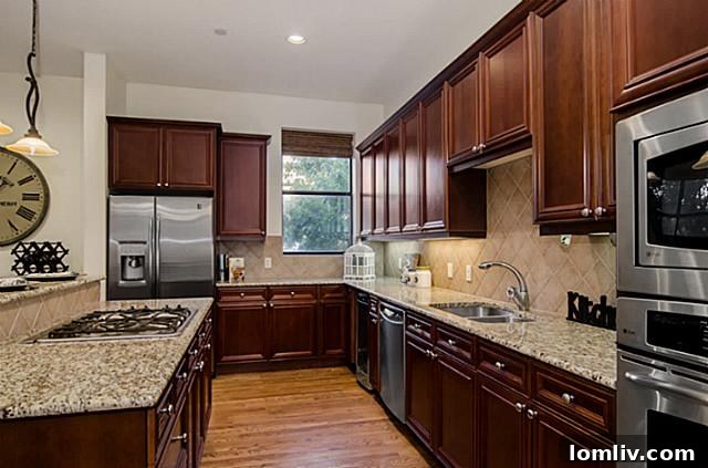 Contemporary kitchen design with stainless steel appliances at 2411 Hall Street