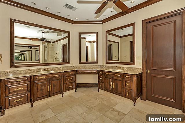 Elegant master bathroom with dual vanities, large mirror, and sophisticated modern design