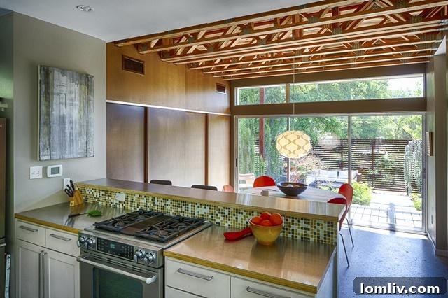 Modern kitchen with stainless steel appliances, open concept, and ample counter space, ideal for culinary enthusiasts.