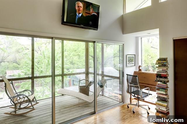 Master bedroom balcony at 8643 Groveland, screened for privacy and comfort, offering serene views.