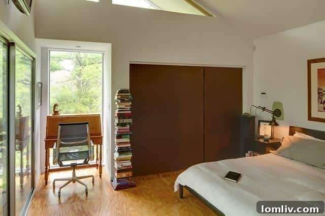 Elegant master bedroom at 8643 Groveland, featuring contemporary design, natural light, and a serene ambiance.