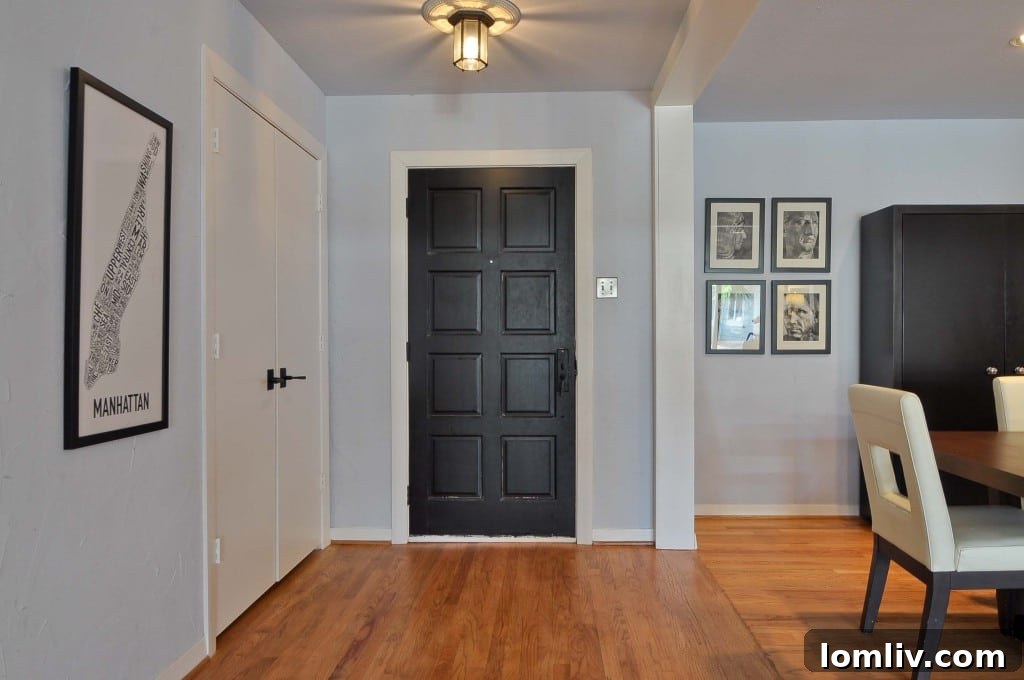 Sunday Six Hundred: From Their Playbook to Ours 5 Elegant Entryway with Hardwood Floors and Warm Lighting