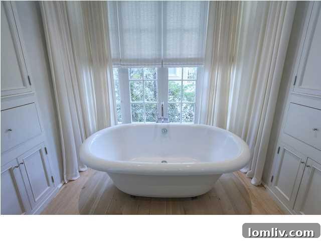 Luxury free-standing bathtub in a bright and airy bathroom