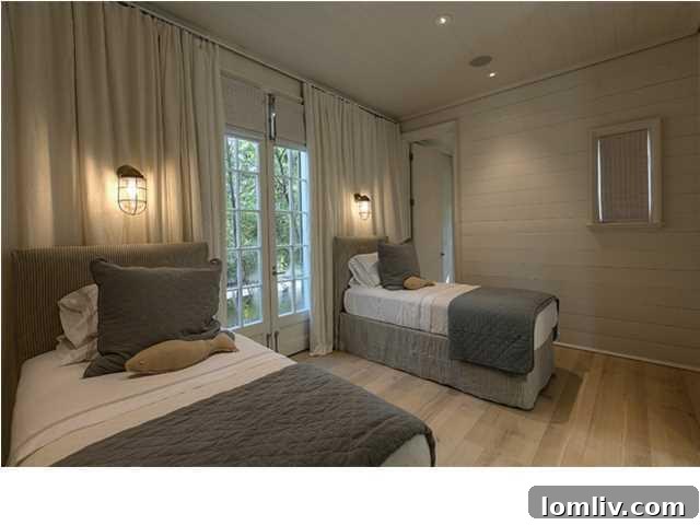 Luxurious master bedroom with coastal decor and ample natural light