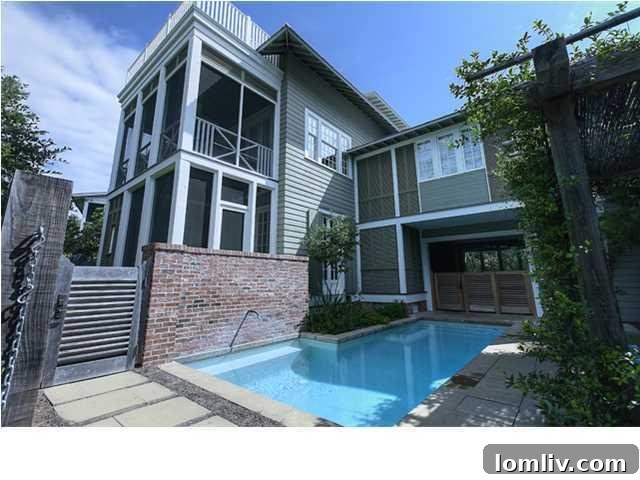 Private outdoor swimming pool with surrounding patio area